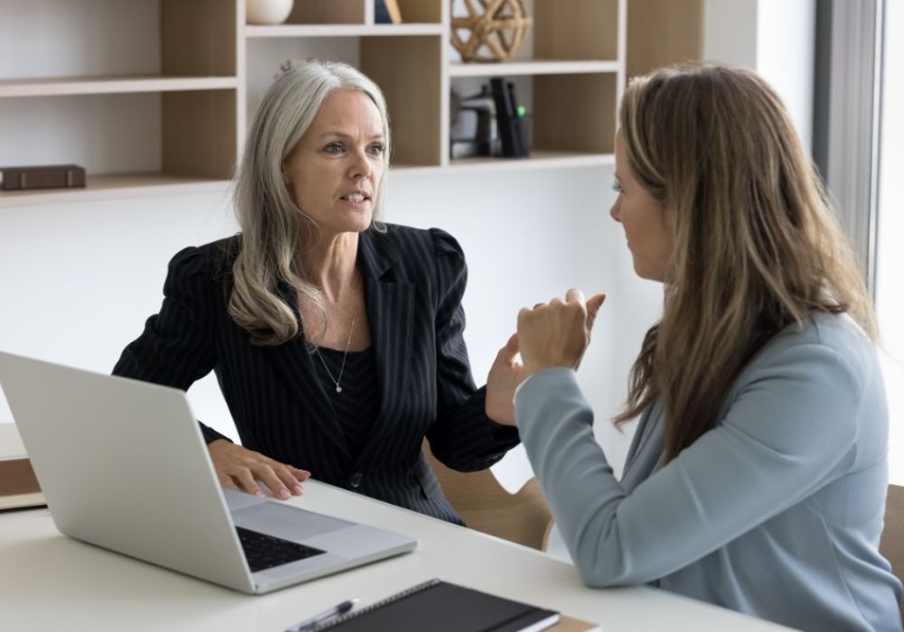 Two women talking during a divorce consultation