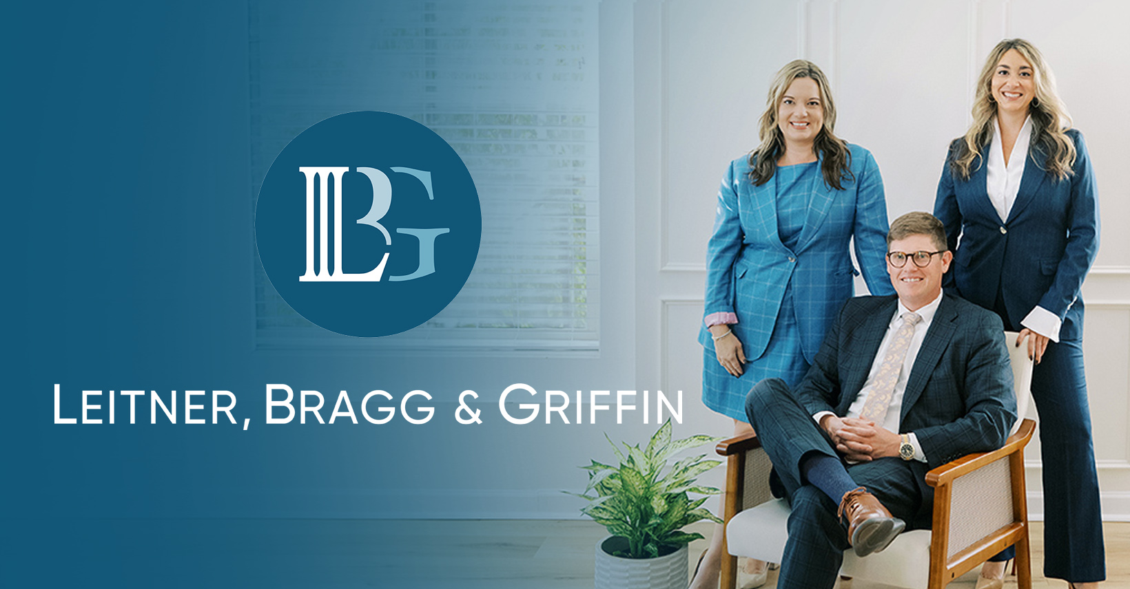 Three professionals at Leitner, Bragg & Griffin office with the firm’s logo and name visible.