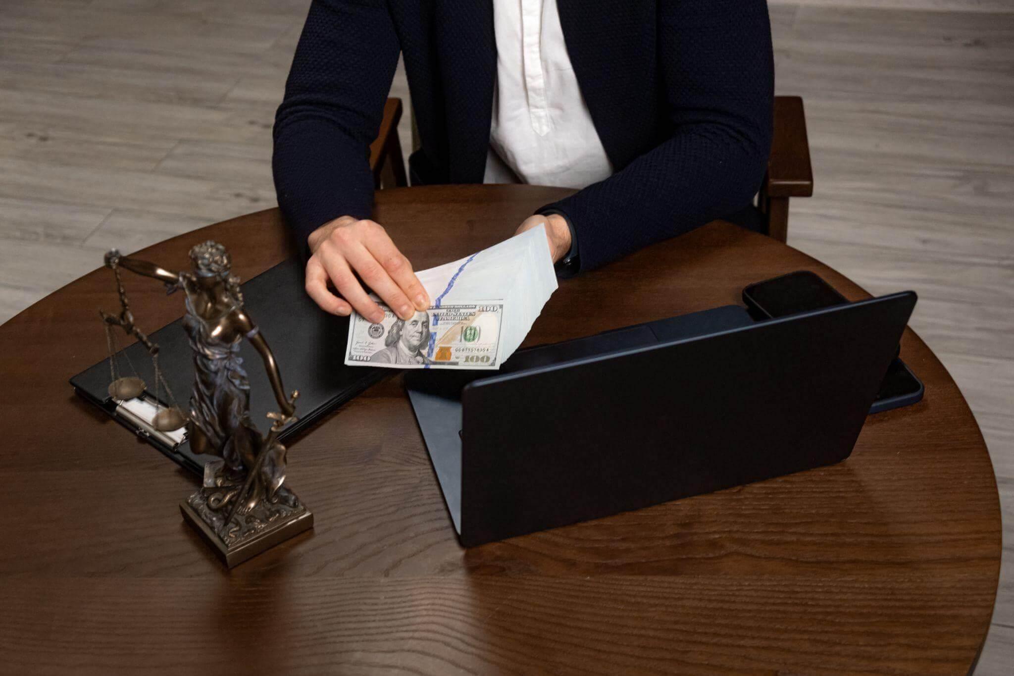 Person reviewing documents at a table for