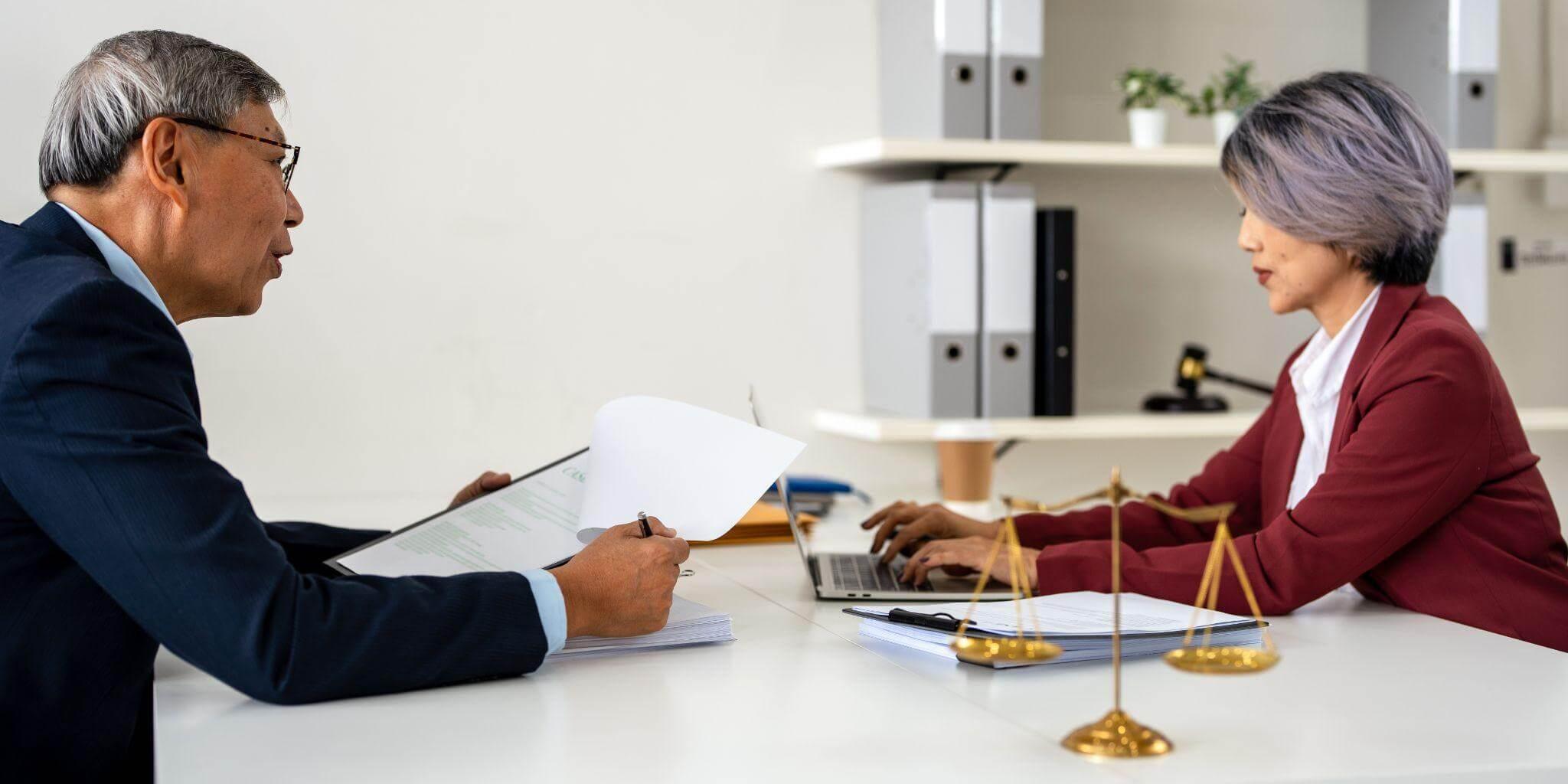 Two people discussing with a Monroe civil litigation attorney