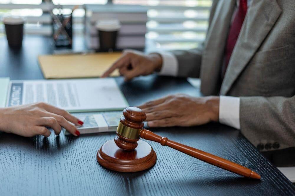 Two people, possibly client and attorney, with